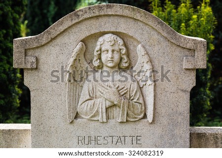 praying angel on gravestone