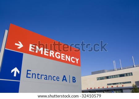 Modern hospital with emergency sign