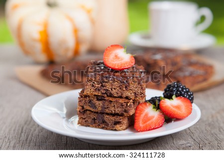 Flourless healthy paleo style pumpkin brownies with chocolate chips, selective focus