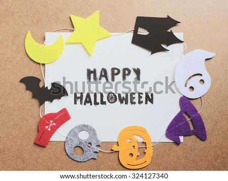 Happy halloween written on paper with halloween ornament for frame 