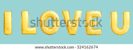 LOVE sign. Golden helium balloons on blue background