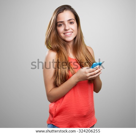 young cute woman using her mobile on white background