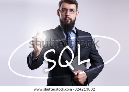 businessman writing SQL with marker on visual screen.Business, technology, internet concept. 