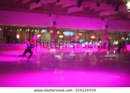 Blurred photo of pink ice rink interior