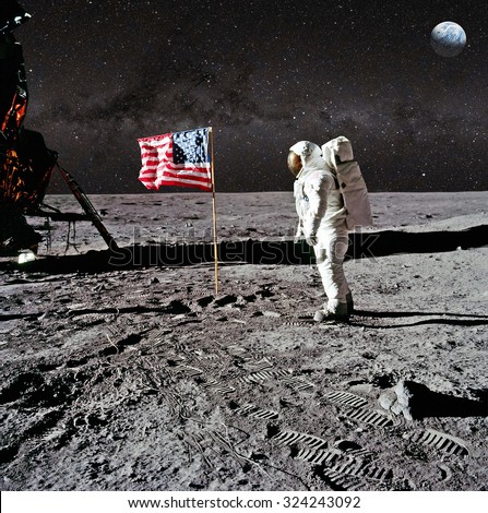 Astronaut on lunar (moon) landing mission. Elements of this image furnished by NASA. Royalty-Free Stock Photo #324243092