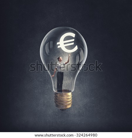 Woman holding luminous idea inside light bulb