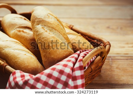 Fresh bread in the basket. Food background. Royalty-Free Stock Photo #324273119