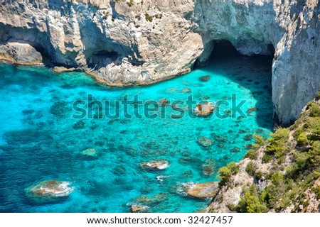 Panoramic view of Kryfo beach and caves in Keri, Zakynthos, Greece. Royalty-Free Stock Photo #32427457