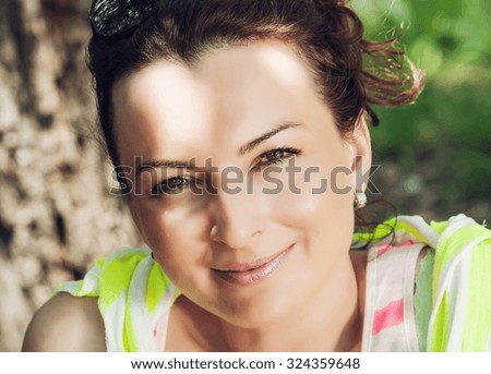 Portrait of young caucasian brunette. Smiling face.