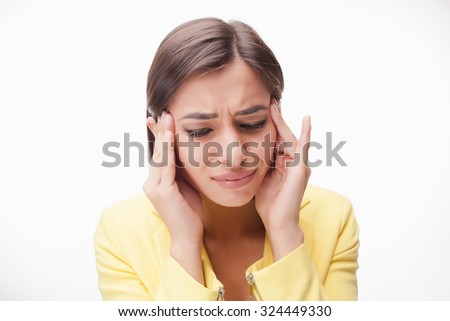 The picture of a tired  and upset business woman on white background in a yellow jacket