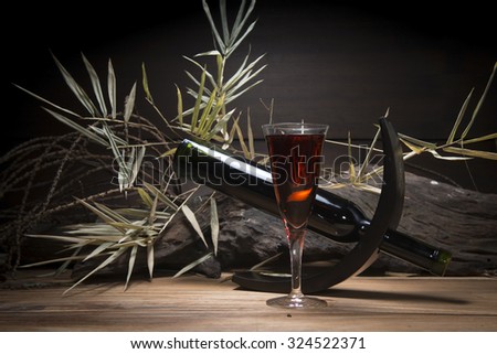 Still life with red wine and wine glass.