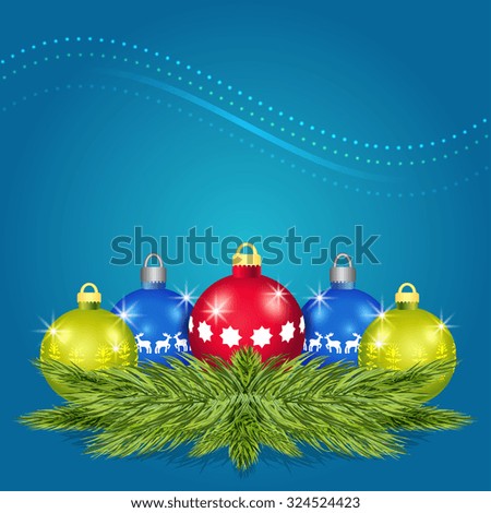 Pine branches with Christmas balls on a blue background