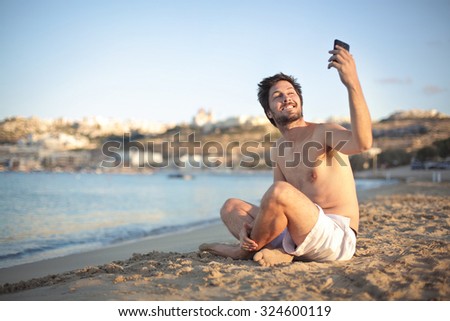 Man doing a selfie at the beach