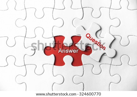 Puzzle with a word Answer and Question Royalty-Free Stock Photo #324600770