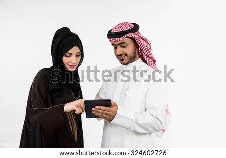 Arab couple using digital tablet