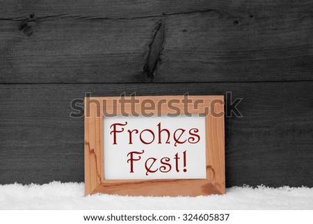 Gray Christmas Card With Brown Picture Frame On White Snow . German Text Frohes Fest Means Merry Christmas. Rustic Wooden, Retro Vintage Background. Black And White