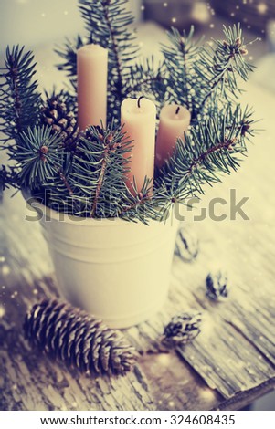 Christmas candles  with fur and pine cone in vintage style / toned pictures