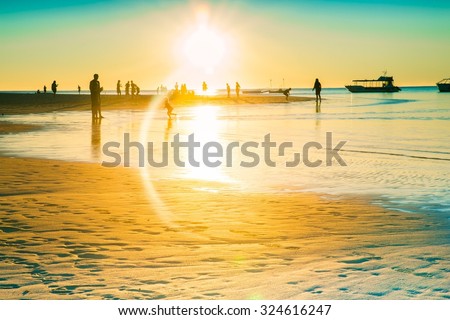 Golden sunset beach Australia silhouette people man boat summer