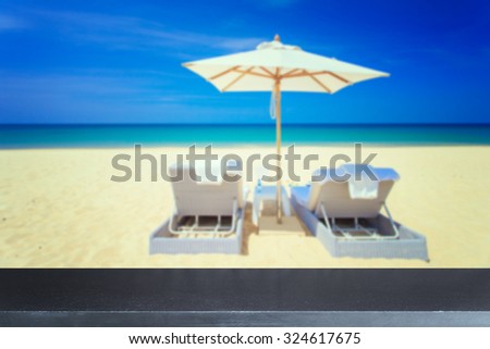 Empty top of natural stone table and view of tropical beach background