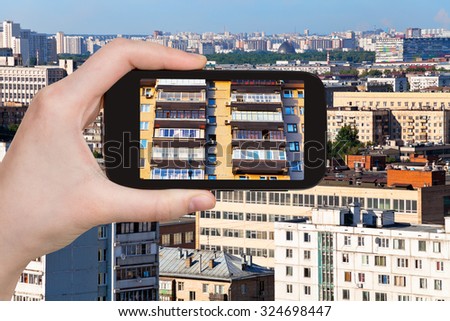 travel concept - tourist photographs picture of city on smartphone