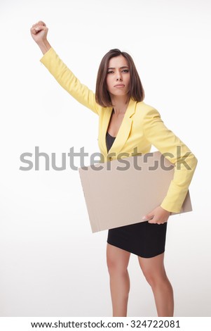serious businesswoman showing board or banner with copy space on white background. concept of leadership 