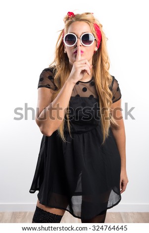 Pin-up girl making silence gesture