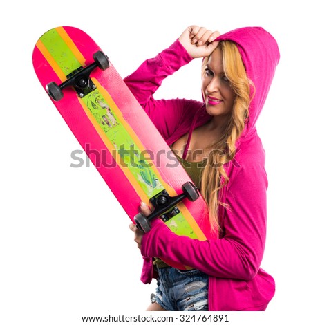 Skateboarder girl with pink sweatshirt