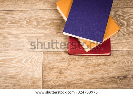 Books on wooden background