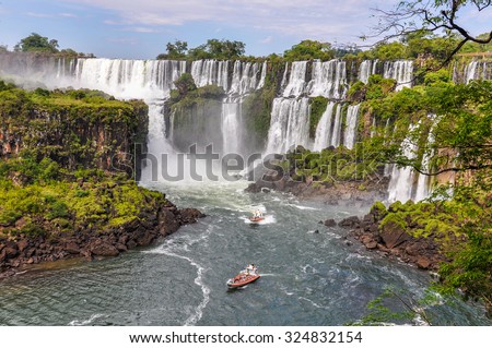Boats around Iguazu Falls, one of the New Seven Wonders of Nature, Argentina Royalty-Free Stock Photo #324832154