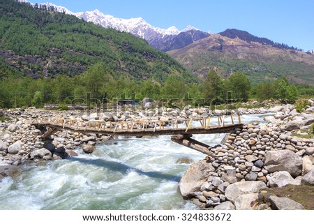 Beas river with wooden bridge in Kullu Valley, Himachal Pradesh, India.
 Royalty-Free Stock Photo #324833672