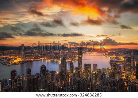 		Sunrise over Victoria Harbor as viewed atop Victoria Peak with Hong kong and Kowloon below
