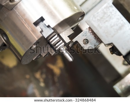 Operator machining high precision mold part by cnc lathe