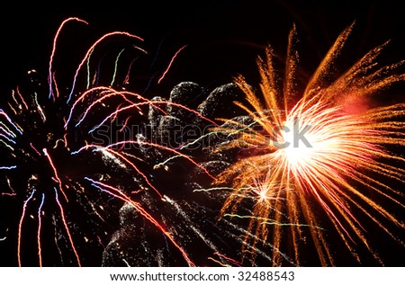 Beautiful fireworks display with muticolored bursts, horizontal with copy space
