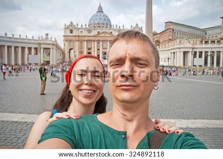 Couple making selfie against Saint Peter`s Basilica, Rome, Italy