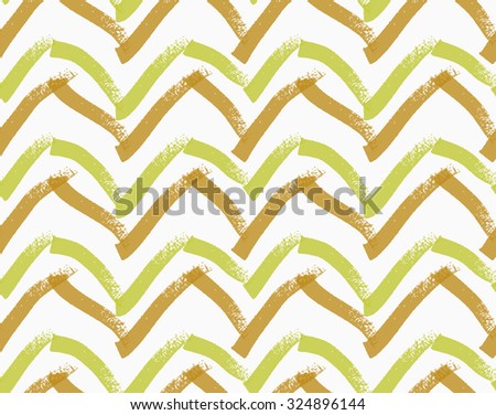 Rough brush brown and green chevron.Abstract colorful seamless background. Stained and grunted texture over hand drawn paint brush ornament.
