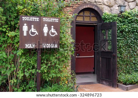 Sign for wc in front of the toilette                      