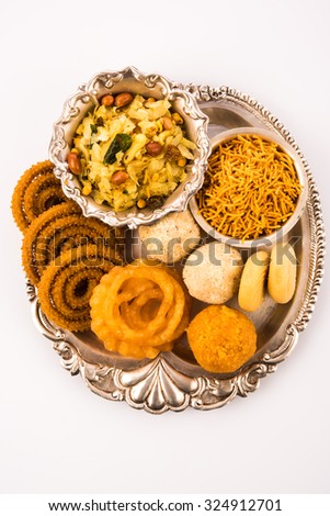 Diwali food / snacks/ sweets in a silver plate