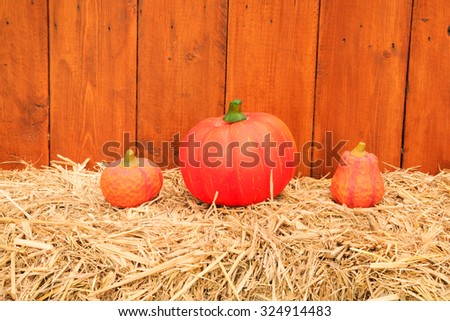 Halloween pumpkin on a bale of hay 