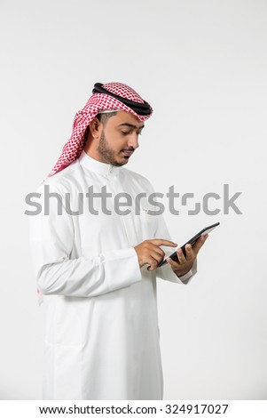 Arab businessman using digital tablet