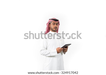 Portrait of Arab businessman holding digital tablet