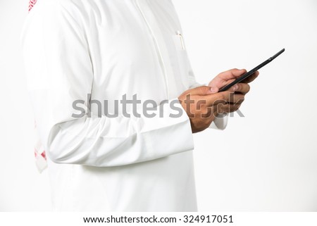 Arab businessman holding digital tablet