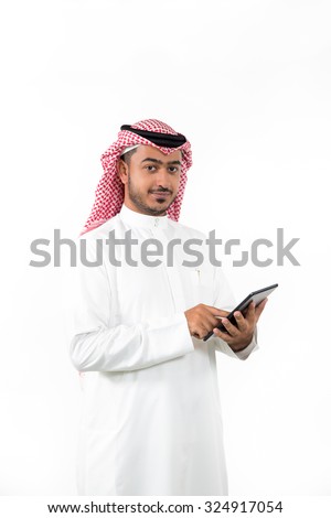Portrait of Arab businessman using digital tablet