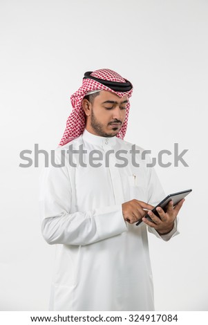 Arab businessman using digital tablet