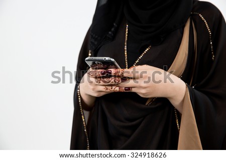 Arab woman messaging on mobile