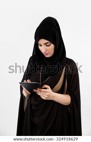 Arab woman using digital tablet