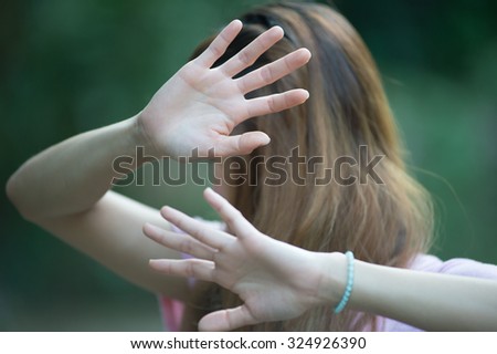 Asian women showing stop hand gesture,  focus hand