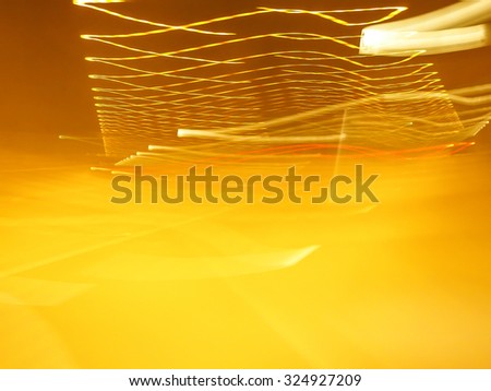 Light car on road yellow color abstract background texture 