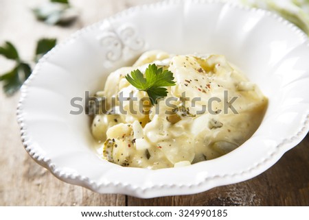 Potato salad with eggs and gherkins