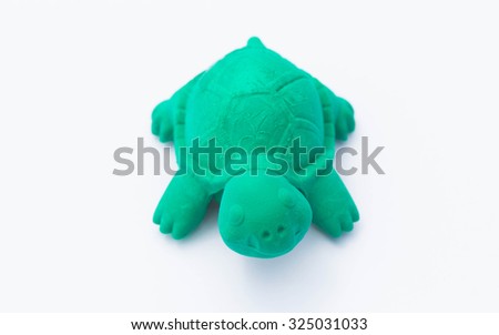 Turtles toys made of rubber on a white background.