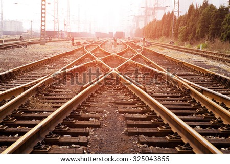 Railway or railroad tracks for train transportation Royalty-Free Stock Photo #325043855